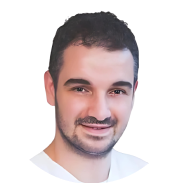 Smiling man looking at the camera with a cheerful expression