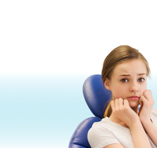 Girl touching her cheek with a painful expression due to toothache